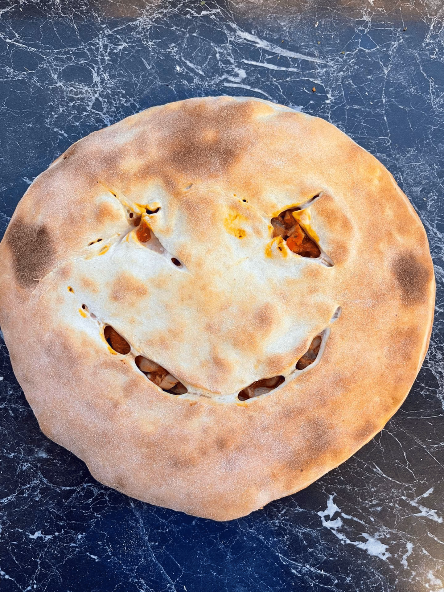 Hvad betyder Calzone?
