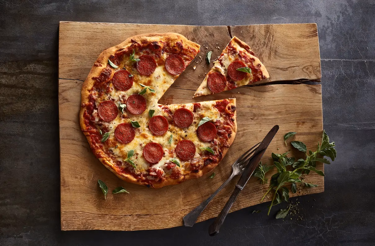 Hvor stor en del af pizzaen får Laura, hvis Mille får af pizzaen, Ida får af pizzaen og Laura får resten?
